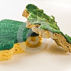 Old and new sponges for household cleaning of kitchen and bathroom