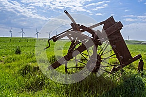 Old and new technology - wind turbines and abandoned plough