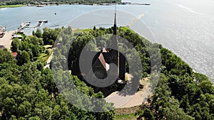 Old nice catholic church. on the shore of lake or sea. Primorsk Koivisto, aerial