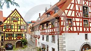 Old nice half-timbered houses in South Germany. Beautiful typical houses in German village. Panoramic view of vintage narrow