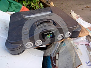 Old Nintendo 64 in a pile of trash
