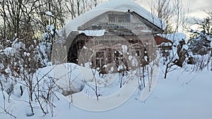 Old non residential house in the village in winter