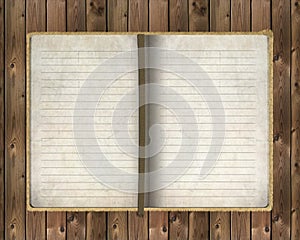 Old notebook on wooden background