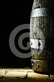 Old oak barrel on flagstones photo