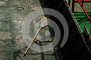 Old oar in a boat and sunlight on it