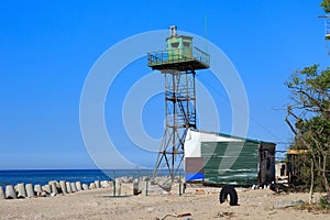 Old observation tower on the sand beach in the Baltic Sea coast