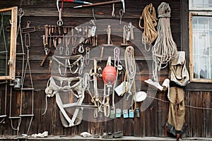 Old, obsolete climbing gear collection hanging on the wall