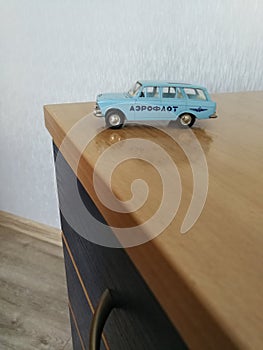 Old obsolete die cast model car on the desk