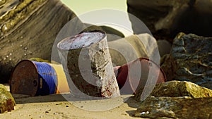 old oil barrell on the sand beach