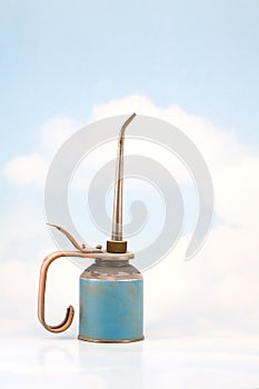 Old Oil Can on Sky Background