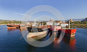 Old oil tanker vessels in a row