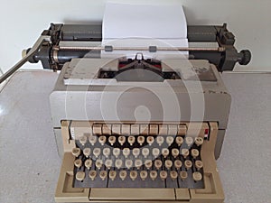 Old, old-fashioned, dirty and rusty typewriter isolated