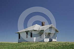 Old one room school house on the rural prairie