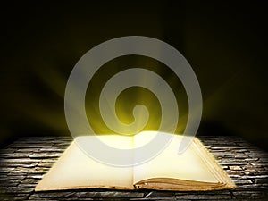 Old open book on stone grunge background