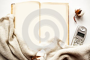 Old open mockup book and sweater