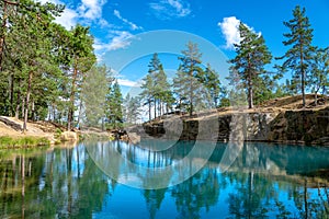 Old open pit mine with crystal clear turquoise water