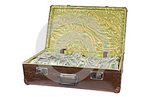 Old opened brown suitcase full of hundred dollar banknotes isolated on white background