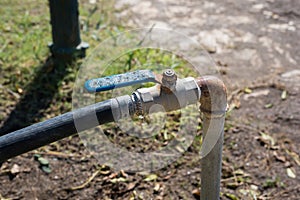 Old opened water garden tap