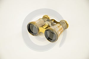 Old opera binoculars isolated on a white background
