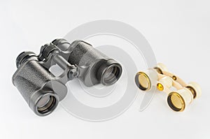 Old opera glass and modern binoculars
