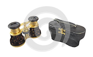 Old opera glasses and case isolated.