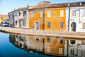 Old orange building water reflection