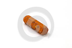Old orange crayon on white background