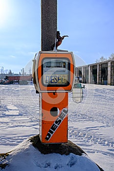 Old orange fuel tank. Diesel gas station, tank in agriculture