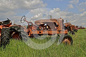 Old orange junked tractors