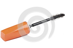 Old orange mascara isolated on white background. Copy space