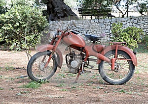 Old orange motorcycle at Masseria Il Frantoio, Southern Italy