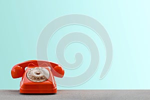 Old orange retro rotary telephone