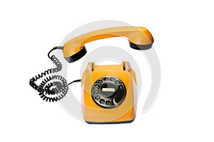 Old, orange rotary dial telephone with hanging receiver, isolated on white