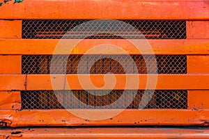 Old orange truck grille.