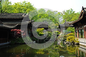 Old oriental structures with garden and fish pond