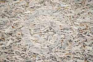 An old oriented strand board OSB , fiberboard background of texture. Sheet is made of brown wood chips pressed together into a woo
