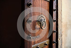 An old, ornamental Indian solid wood door close up