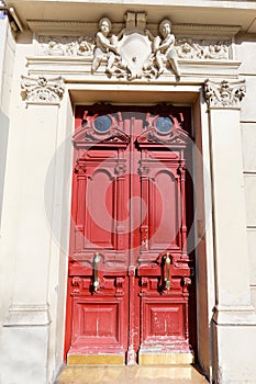 Old ornate door in Paris - typical old apartment buildiing.