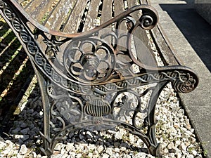 Old ornate metal bench in the public cemetery