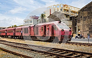 Old & overcrowded commuter diesel train in Colombo City centre Sri Lanka