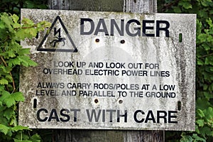 Old Overhead Electric Cable Warning Sign for Anglers