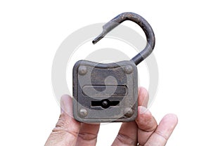Old padlock in hand isolated on white background.