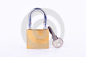 old padlock or master key and key on white background tool isolated