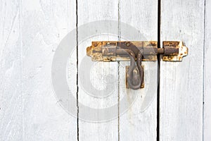 Old padlock on old wooden door