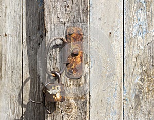 Old padlock on the wooden door