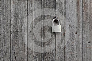 Old padlocked on wooden door