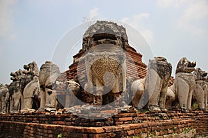 Old Pagoda With Stucco Lion And Bricks Walls