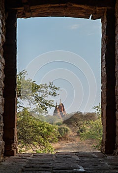 Old Pagodas Bagan Myanmar looking through brick window