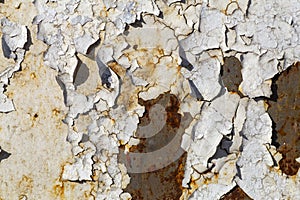 Old paint background. Texture and pattern of peeling dried old paint on the wall. Old painted wall background