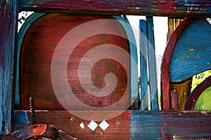 Old Painted & Stained Wooden Chairs Made into a Colorful Fence